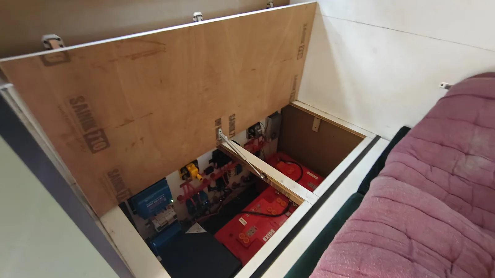 The bed platform with the large storage compartment accessible underneath.